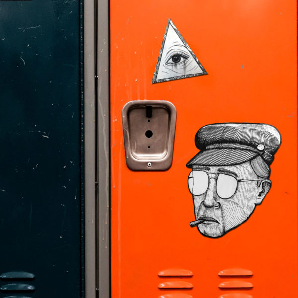 black and white magnets on an orange locker